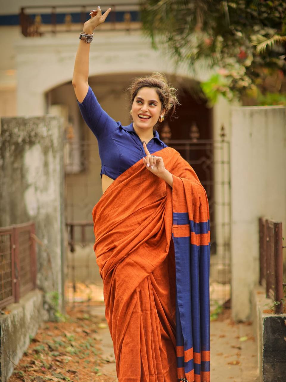 Rust Orange Linen Saree with Navy Blue Contrast Pallu & Tassels | Modern Minimal Everyday Wear