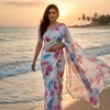 Ivory Whisper Organza Saree with Multicolor Leaf Motifs & Pearl Finish Border