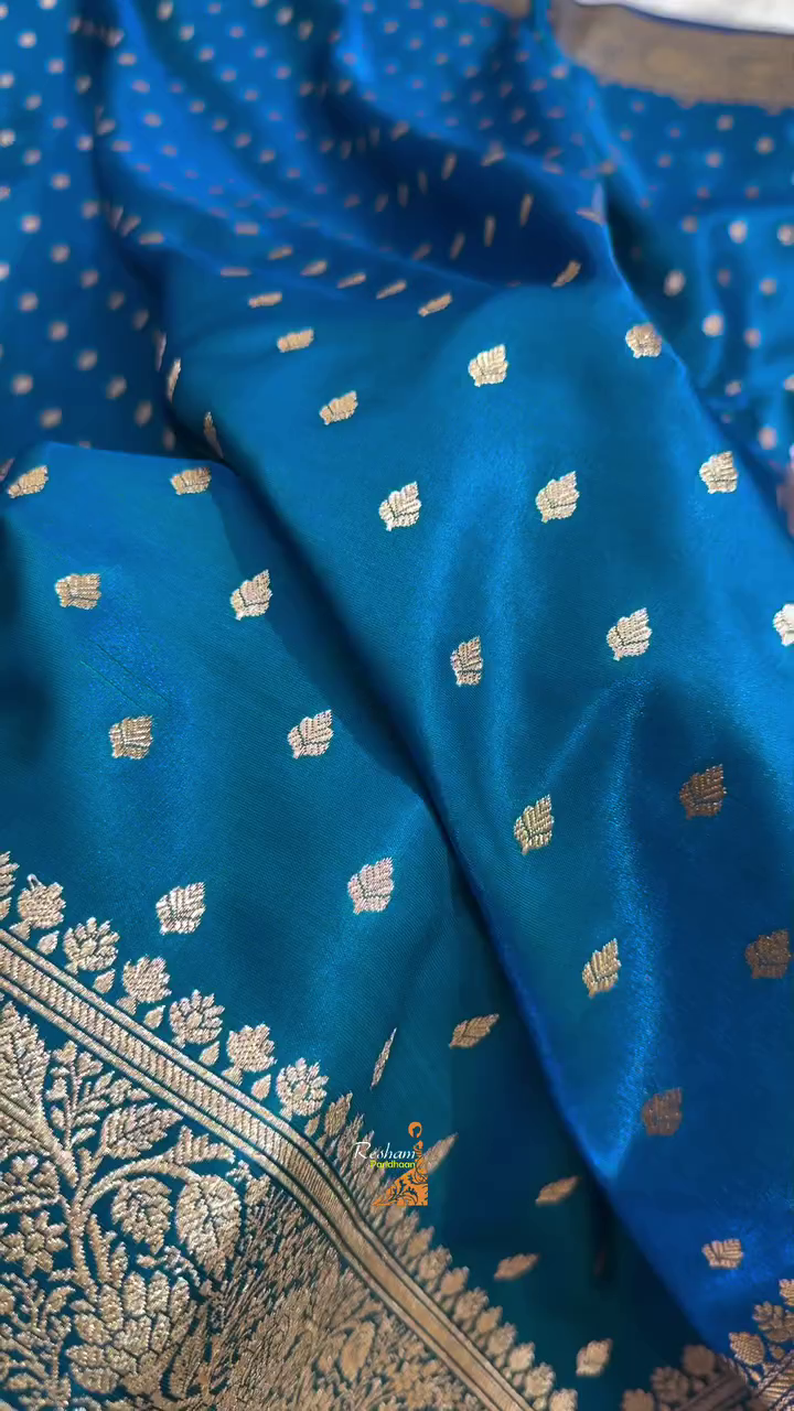 Teal Blue Banarasi Silk Saree – Golden Zari Butta & Rich Floral Border
